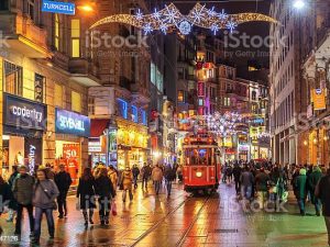 Istanbul, Turkey - February 22, 2016: Nostalgic tramway on the main pedestrian Taksim Istiklal Street at late evening