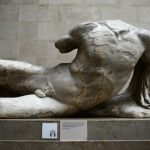 The Ilissos statue, part of a collection of stone objects, inscriptions and sculptures, known as the Elgin Marbles, is displayed at the Parthenon Marbles' hall at the British Museum in London in this file photograph dated October 16, 2014. The British Museum said on Friday it has loaned one of the "Elgin Marbles" to Russia, the first time any of the controversial ancient sculptures have left Britain since they were taken from the Parthenon in Athens some 200 years ago.  REUTERS/Dylan Martinez/files  (BRITAIN - Tags: ENTERTAINMENT POLITICS SOCIETY)